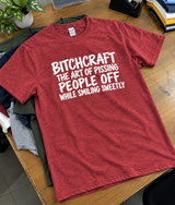 Bitchcraft The Art Of Pissing People Off While Smiling Sweetly T-Shirt