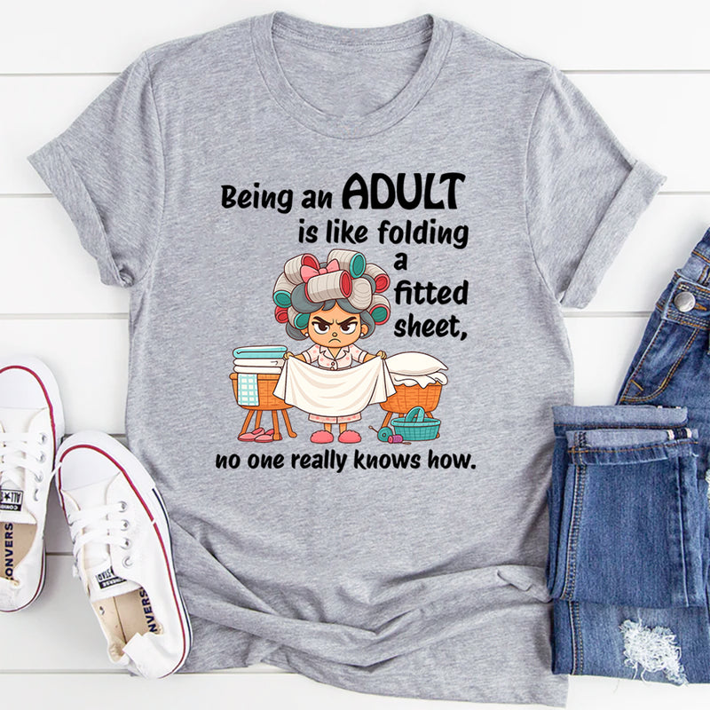 Being An Adult Is Like Folding A Fitted Sheet No One Really Knows How  T-Shirt