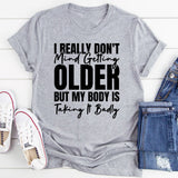 I Really Don’t Mind Getting Older, But My Body Is Taking It Badly T-Shirt