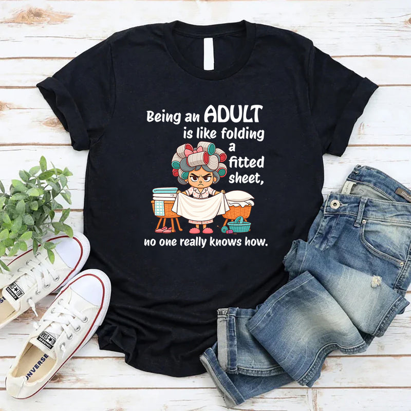 Being An Adult Is Like Folding A Fitted Sheet No One Really Knows How  T-Shirt