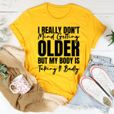 I Really Don’t Mind Getting Older, But My Body Is Taking It Badly T-Shirt