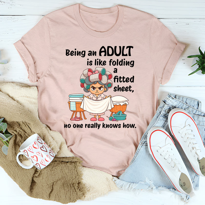 Being An Adult Is Like Folding A Fitted Sheet No One Really Knows How  T-Shirt