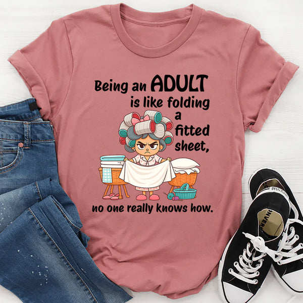 Being An Adult Is Like Folding A Fitted Sheet No One Really Knows How  T-Shirt