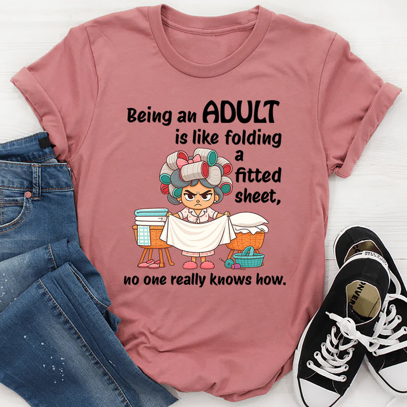 Being An Adult Is Like Folding A Fitted Sheet No One Really Knows How  T-Shirt