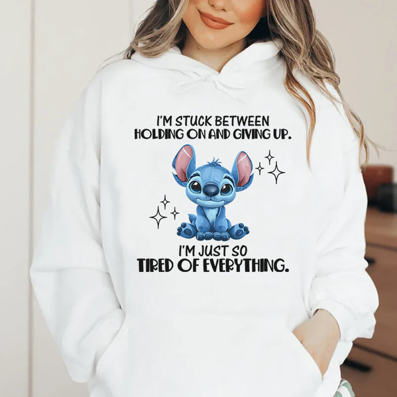 I’m Stuck Between Holding On and Giving Up. I’m Just So Tired of Everything Hoodie